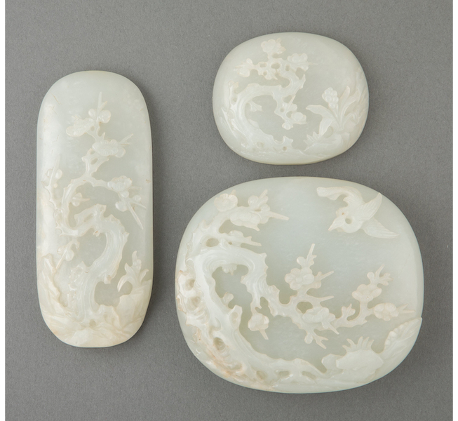 Trio of Chinese Qing dynasty jade carved plaques from a Ruyi scepter, estimated at $1,500-$2,500. Image courtesy of Heritage Auctions