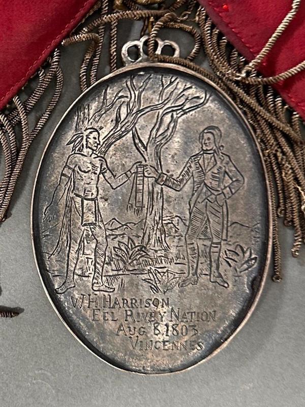 Oval coin silver peace medal with hand-engraved scenes on the obverse and the reverse, estimated at $1,000-$2,000