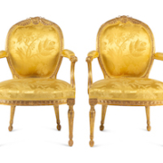Pair of George III carved gilt wood armchairs, $56,700