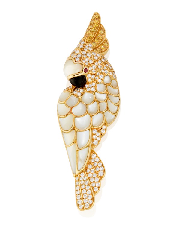 Tiffany & Co. mother-of-pearl, diamond, yellow sapphire, and onyx bird brooch, estimated at $7,000-$9,000