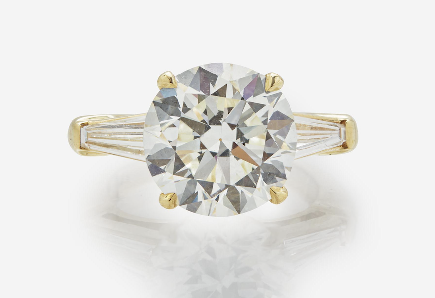 18K gold ring centered on a GIA-certified 5.85-carat diamond, estimated at $70,000-$90,000