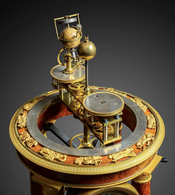 Detail of Empire Amboyna orrery and music box by Raingo, estimated at $150,000-$250,000