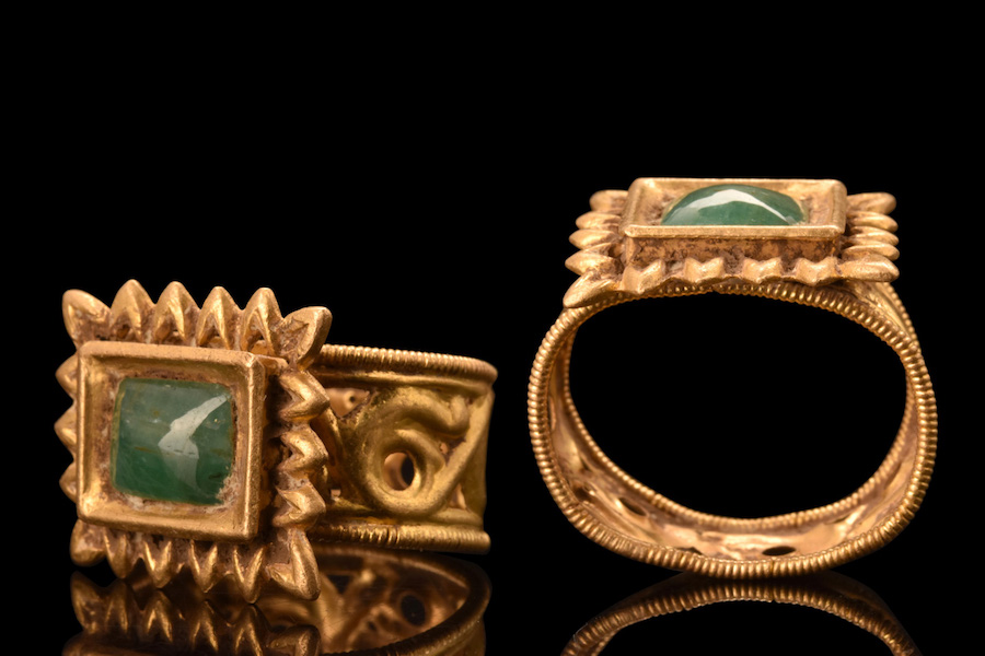 Byzantine gold ring with central emerald, beaded borders flanking openwork design of scrolled decoration. XRF analysis of metallurgical content suggests ancient origin and detects no sign of modern trace elements. Provenance: London private collection. Estimate £3,000-£6,000 ($3,760-$7,520). Image courtesy of Apollo Art Auctions, London