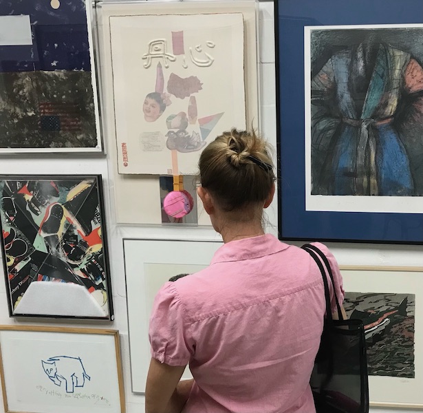 A local patron peruses the collection of Graphicstudio prints at Myers Fine Art’s gallery in St. Petersburg, Florida. Image provided by Myers Fine Art