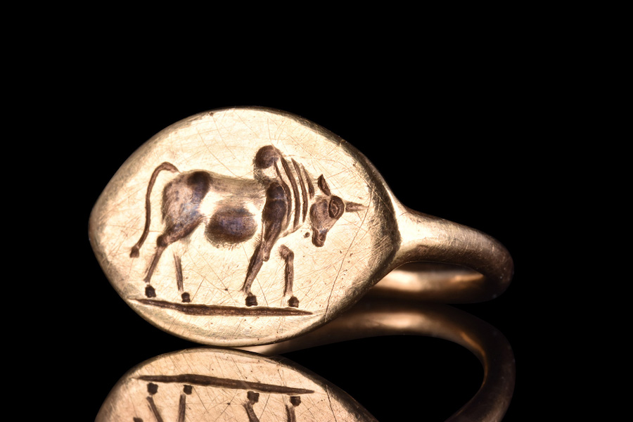 Greek Hellenistic gold ring with pointed, lozenge-shape ring and skillfully engraved depiction of a bull, circa 500-400 BC. XRF analysis of metallurgical content suggests ancient origin and detects no sign of modern trace elements. Provenance: London private collection; British art market 1990s. Estimate £6,000-£12,000 ($7,520-$15,032). Image courtesy of Apollo Art Auctions, London
