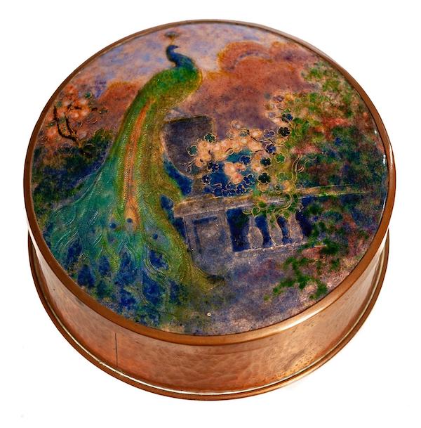 Enamel on copper canister by Frank J. Marshall, titled ‘Peacock in a Garden,’ estimated at $2,000-$4,000