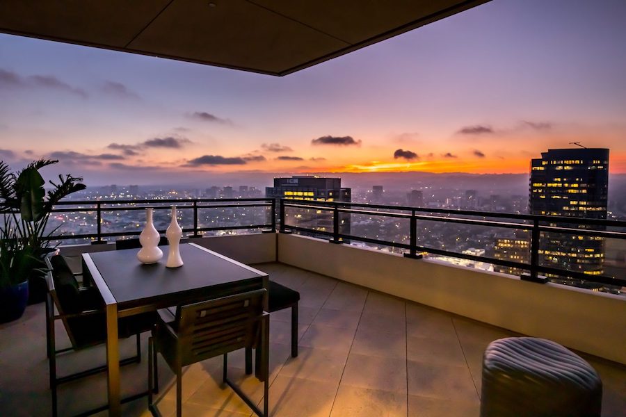 The generously-sized penthouse delivers sprawling rooms to match the sprawling Los Angeles views, as well as four terraces, including the one shown here. Photo credit Michael MacNamara and Jason Speth; image courtesy of Compass and also TopTenRealEstateDeals.com