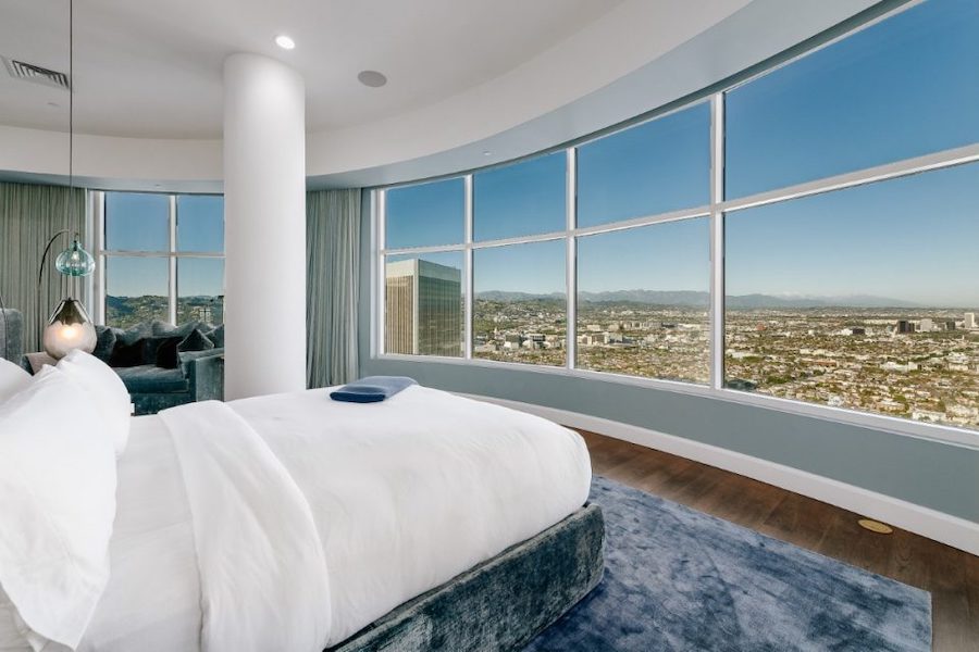 The master bedroom suite is just one of several areas of the 40th-floor penthouse that allows spectacular views of Los Angeles. Photo credit Michael MacNamara and Jason Speth; image courtesy of Compass and also TopTenRealEstateDeals.com