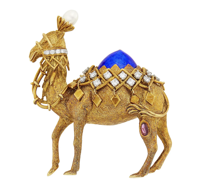 Jean Schlumberger for Tiffany & Co. camel brooch in 18K gold, blue paillone enamel, diamonds, a freshwater pearl and a pink sapphire, estimated at $8,000-$12,000. Image courtesy of Doyle and LiveAuctioneers