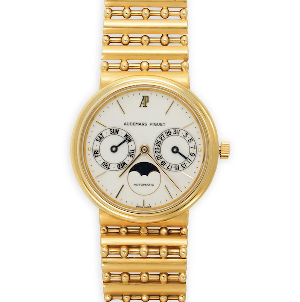 Audemars Piguet 18K gold Day-Date watch, estimated at $8,000-$12,000
