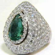 Puffed dome 18K white gold and diamond ring centered on a 3.10-carat natural emerald, estimated at $18,000-$22,000