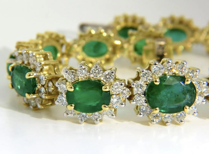 18K gold halo bracelet with emeralds and diamonds, estimated at $17,000-$20,000 