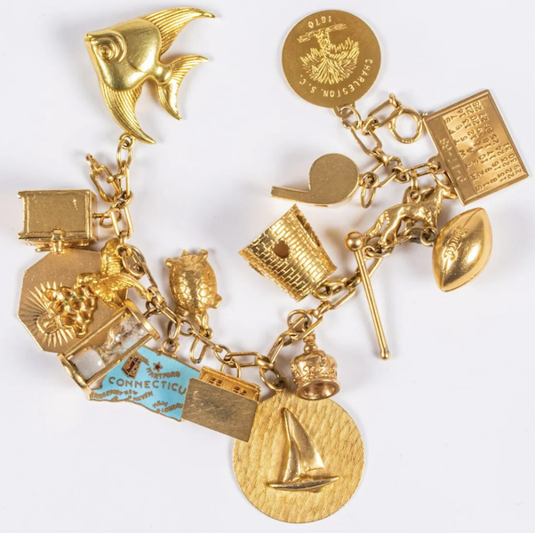 14K gold and gold-plated bracelet with 17 charms, estimated at $1,500-$2,000. Image courtesy of Gray’s Auctioneers and LiveAuctioneers