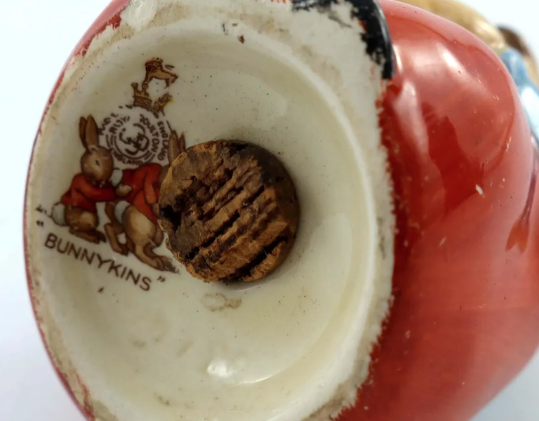 The tug of war backstamp, seen here on the underside of a figural pepper pot that sold for $3,748 plus the buyer’s premium in October 2021, was used on Royal Doulton Bunnykins pieces from 1937 onward. Image courtesy of Kinghams Auctioneers and LiveAuctioneers.