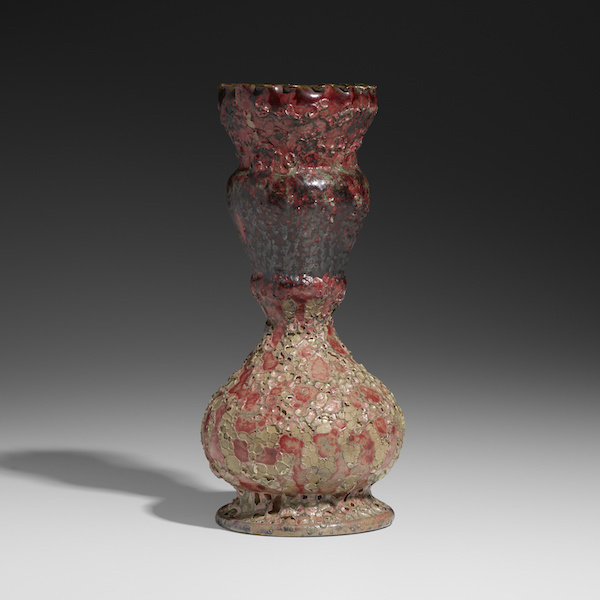 Exceptional vase by George Ohr with raspberry, gunmetal, green and gray volcanic glaze, estimated at $25,000-$35,000. Image courtesy of Rago Arts and Auction Center