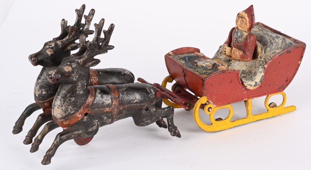 Rare Kyser & Rex cast-iron Santa in Sleigh toy pulled by two reindeer, 13in long. All original with very nice paint. Estimate $6,000-$8,000