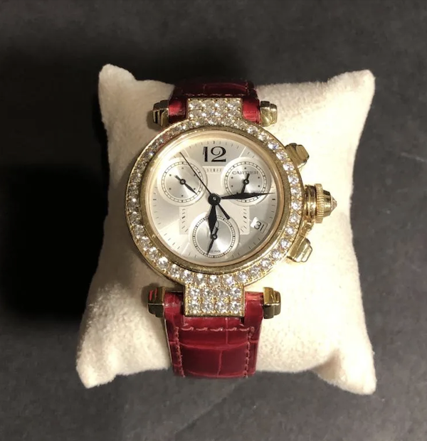 Cartier 18K yellow gold and diamond Pasha chronograph watch on red leather strap. Three sub-dials, and date window. Recently serviced by Cartier. Estimate $10,000-$12,000
