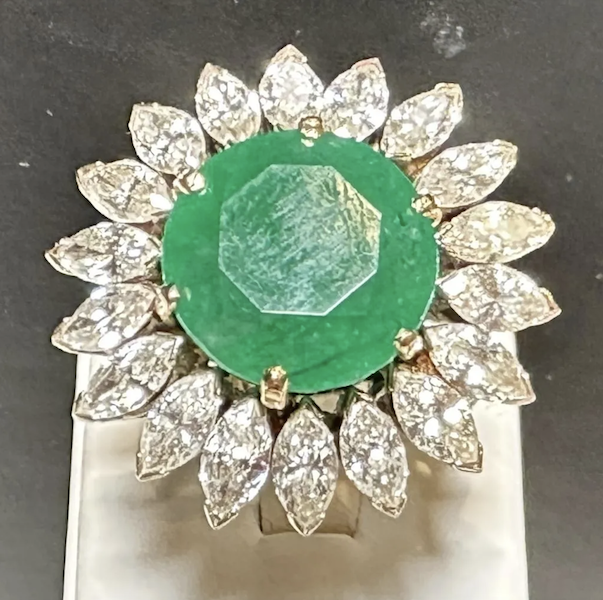 GIA 14K white gold emerald and diamond ring. Emerald weighs approximately 12-13 carats; 18 marquis diamonds total approximately 3.5 carats (H-I color, VS2-SI1 clarity. Total weight: 15.3g. Accompanied by GIA Certificate. Estimate $4,000-$6,000