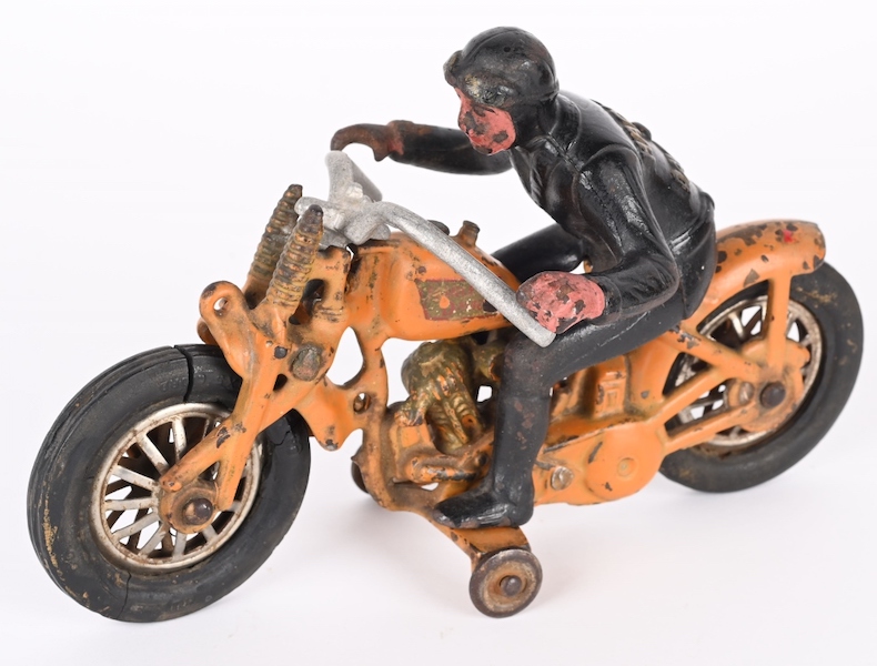 Hubley cast-iron Harley-Davidson Hill Climber motorcycle, 8½ inches long, scarce orange color. All original with no breaks or repairs. Estimate $5,000-$8,000