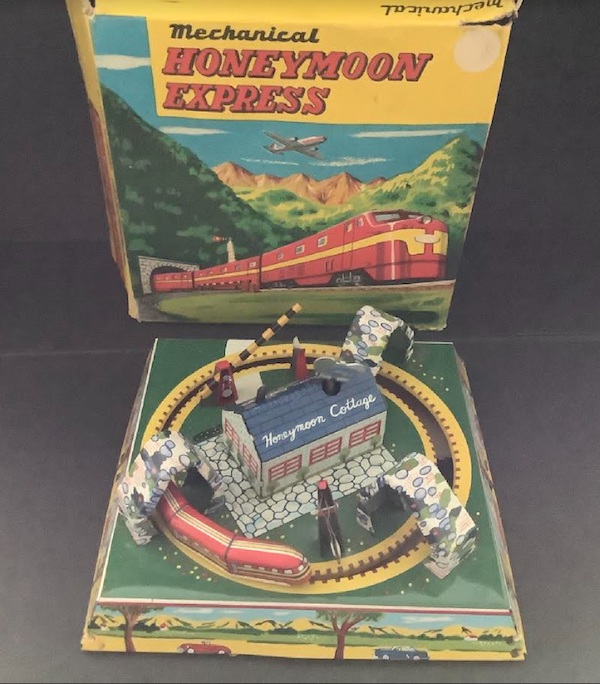 Louis Marx & Co Honeymoon Express windup mechanical tin train with cottage, estimated at $250-$500