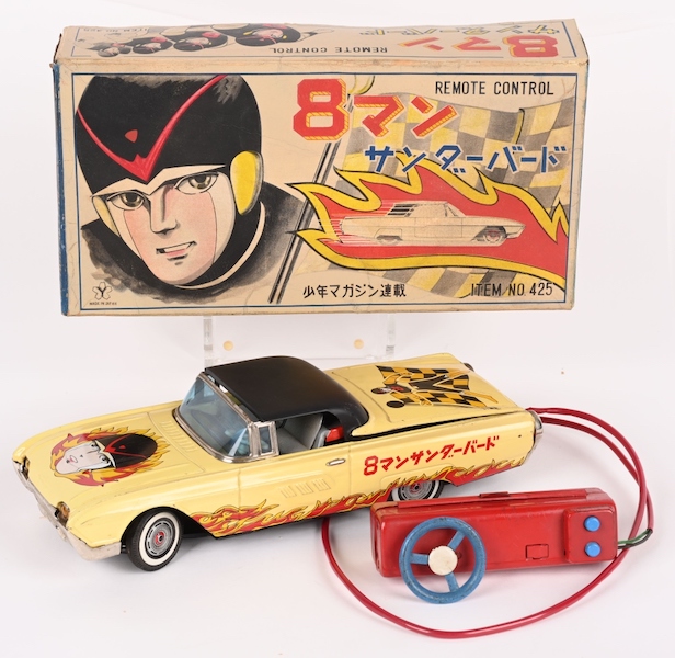 Yone/Yonezawa (Japan) 12in battery-operated 8 Man remote-control Thunderbird car. All original and complete with retractable roof and steerable remote control. Sensational graphics on toy and original box (some restoration). Estimate $3,000-$5,000