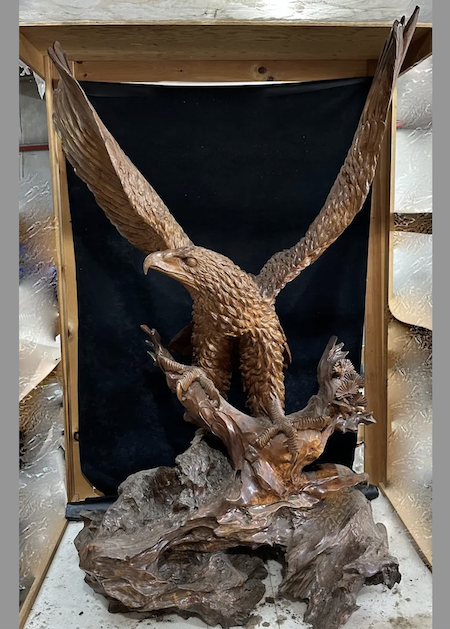 Monumental carved wood eagle, 77in x 48in x 36in, on naturalistic carved rock-form base. Skillfully executed. A very substantial and heavy piece. Estimate $2,000-$3,000