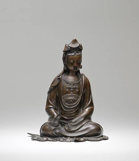 17th-century bronze seated Guanyin figure, £82,200. Image courtesy of Bonhams