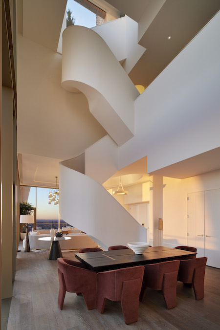 A standout feature of the 5,500-square-foot penthouse is its dramatic spiral staircase. Photo credit: Sean Hemmerle. Courtesy of TopTenRealEstateDeals.com