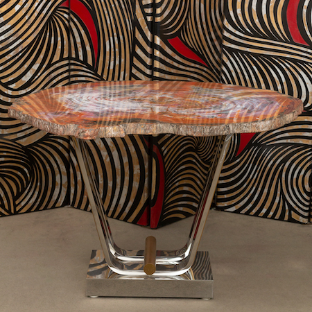 Karl Springer custom petrified wood tulip-base table, estimated at $10,000-$15,000. Image courtesy of Abell Auction Co.