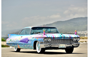 Joy on wheels: Kenny Scharf art car leads parade at Heritage, May 23