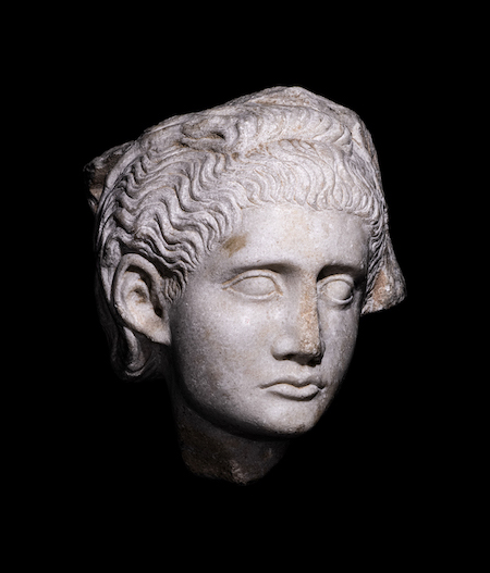 Roman marble relief with a female head, estimated at $5,000-$7,000