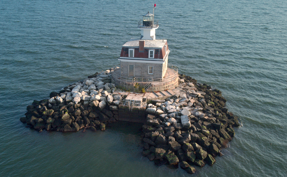 The Penfield Reef Lighthouse in Fairfield, Conn., photographed in September 2019. It is one of four lighthouses being offered at auction by the U.S. government’s General Services Administration. Image courtesy of Wikimedia Commons, photo credit Hallettx. Shared under the Creative Commons Attribution-Share Alike 4.0 International license.