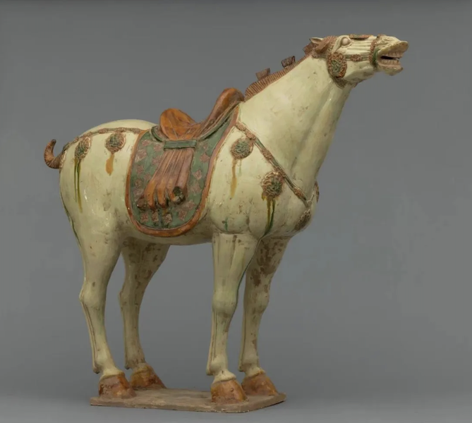 Large Tang dynasty sancai-glazed, tri-color painted pottery horse, shown neighing, estimated at $45,000-$60,000