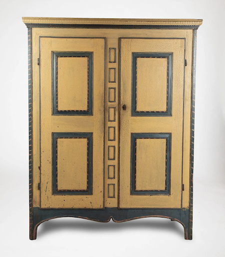 Another angle on the circa-1820 Quebec armoire with strong alligatored yellow paint that earned it the nickname Armoire Crocodile, estimated at CA$30,000-$40,000
