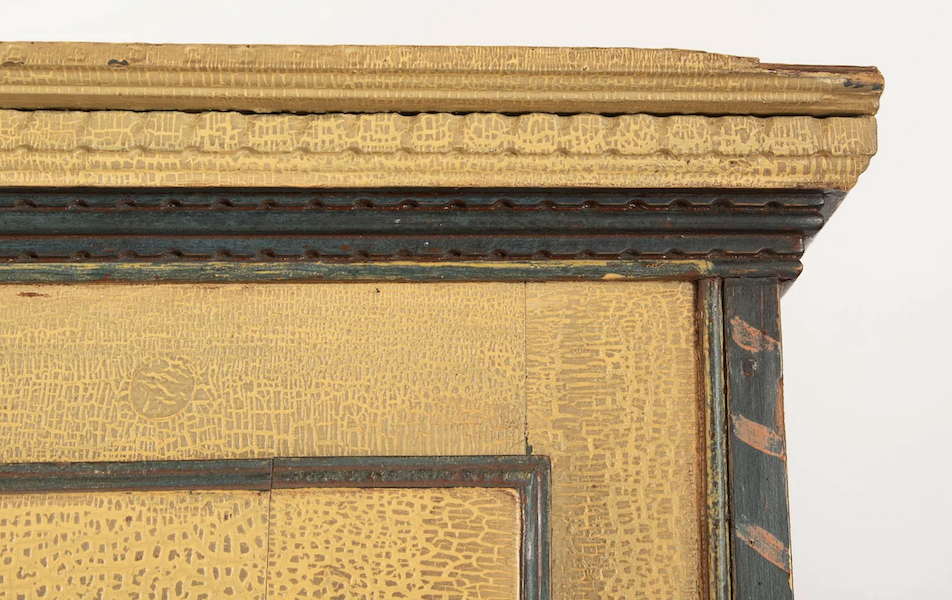 Detail of circa-1820 Quebec armoire with strong alligatored yellow paint that earned it the nickname Armoire Crocodile, estimated at CA$30,000-$40,000