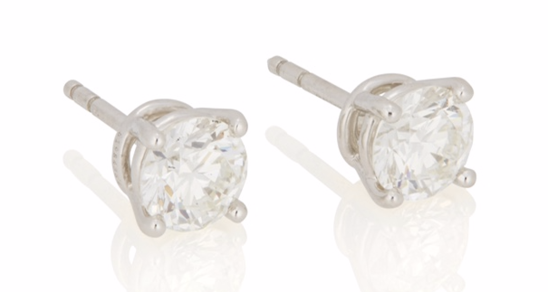 Pair of Tiffany & Co. diamond stud earrings, estimated at $5,000-$7,000 