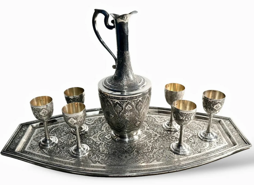 Circa-1920s Persian sterling silver set consisting of a ewer, goblets and tray, estimated at $600-$1,200. Image courtesy of Kensington Estate Auction