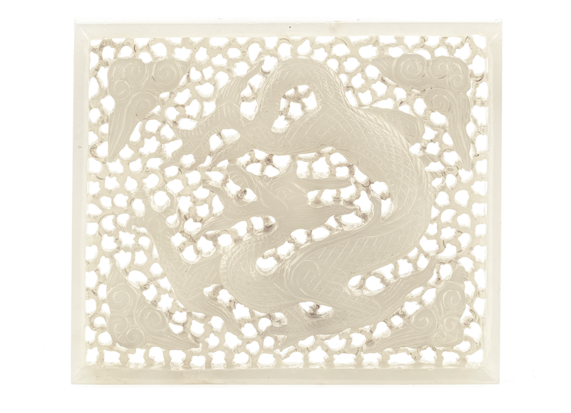 Ming dynasty carved and pierced white jade dragon plaque, £65,820. Image courtesy of Bonhams