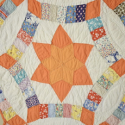 Detail of unusual 1930s Wedding Ring Stars pattern quilt, estimated at $700-$1,000