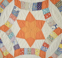 Detail of unusual 1930s Wedding Ring Stars pattern quilt, estimated at $700-$1,000
