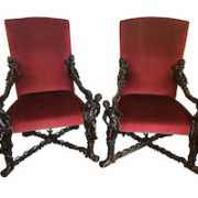 Pair of circa-1880s Italian Baroque throne chairs with figural carvings, estimated at $35,000-$42,000