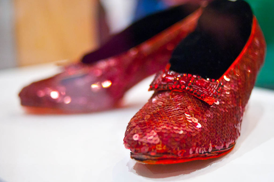 Pair of ruby slippers worn by Judy Garland in the classic 1939 movie ‘The Wizard of Oz,’ photographed at the Smithsonian National Museum of American History in October 2011. In 2005, a different pair of Garland-worn ruby slippers was stolen from a Minnesota museum devoted to the late actress. On May 17, federal prosecutors in North Dakota announced that a grand jury had indicted Terry Martin for the theft of the iconic footwear. Image courtesy of Wikimedia Commons, photo credit Chris Evans. Shared under the Creative Commons Attribution 2.0 Generic license.
