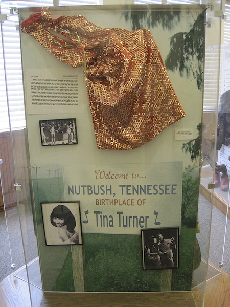 Sequined dress worn by singer Tina Turner, photographed in May 2012 on display at the West Tennessee Music Museum at the West Tennessee Delta Heritage Center in Brownsville, Tenn. Two years later, the institution would create a dedicated Tina Turner Museum on site, where fans gathered on May 24 after news broke of her death at age 83. Image courtesy of Wikimedia Commons, photo credit Thomas R Machnitzki (thomas@machnitzki.com). Shared under the Creative Commons Attribution 3.0 Unported license.
