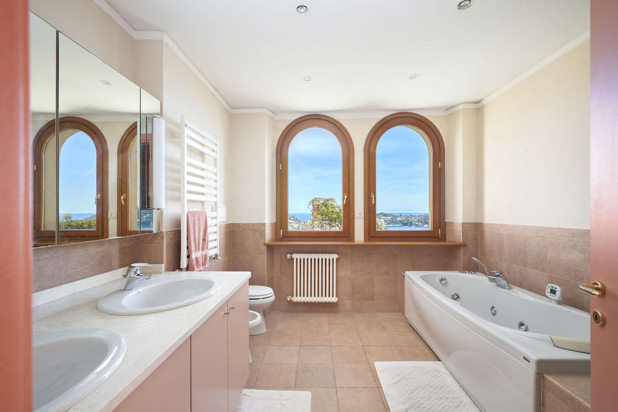 The arched window motif carries through to the master bathroom, one of six in the exquisite manor house on the French Riviera. Photos courtesy Concierge Auctions and TopTenRealEstateDeals.com.