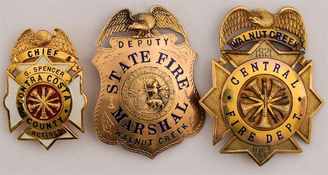 Archive of fireman Guy Fremont Spencer, which includes early to mid-20th-century gold California fire department badges, estimated at $6,000-$10,000