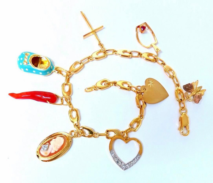 14K gold eight-charm link bracelet, estimated at $1,500-$2,000 