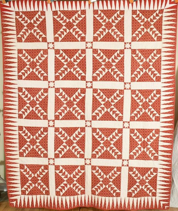 1870s cotton quilt with red and white flying geese pattern, estimated at $1,200-$1,500