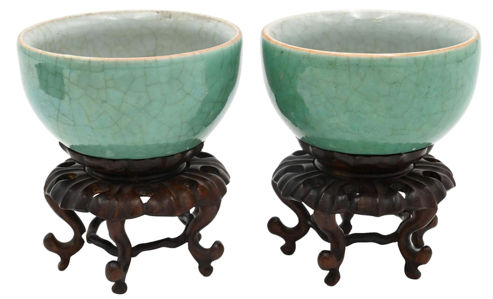 Crackle glaze tea cups on wood stands in a fitted box, $5,440. Image courtesy of Nadeau’s Auction Gallery
