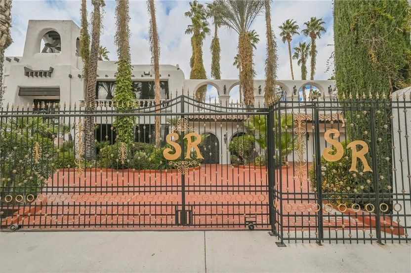 Electric gates surround the Las Vegas property which, in places, sport the initials of the magicians Siegfried and Roy. Photo courtesy of eXp Realty and TopTenRealEstateDeals.com