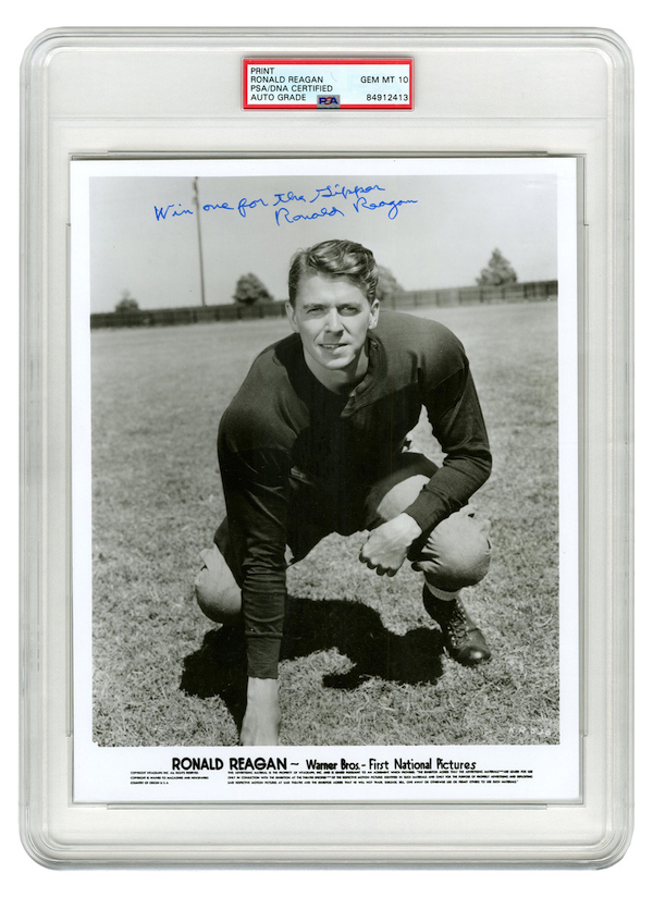 Vintage Warner Brothers press photo of a young Ronald Reagan in football gear, signed by him as “Win one for the Gipper / Ronald Reagan,” PSA/DNA encapsulated and graded GEM Mint 10, estimated at $15,000-$20,000
